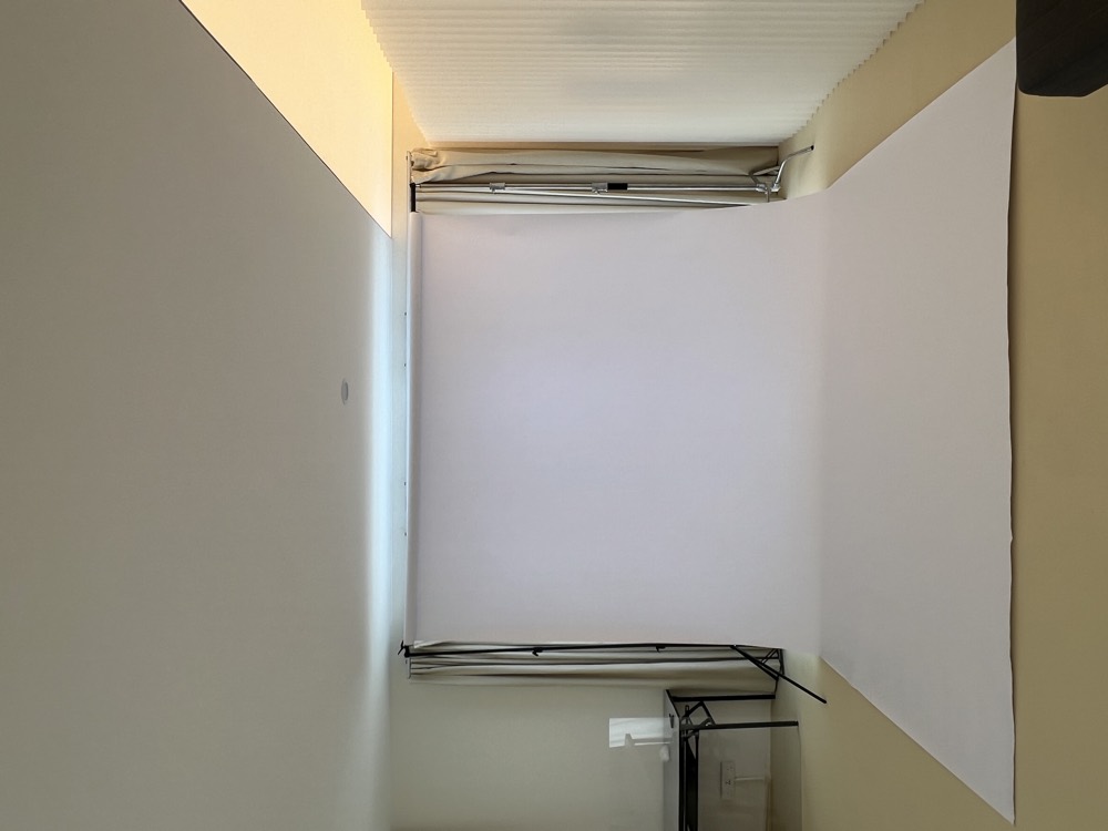 Seamless white paper backdrop on stands in the studio